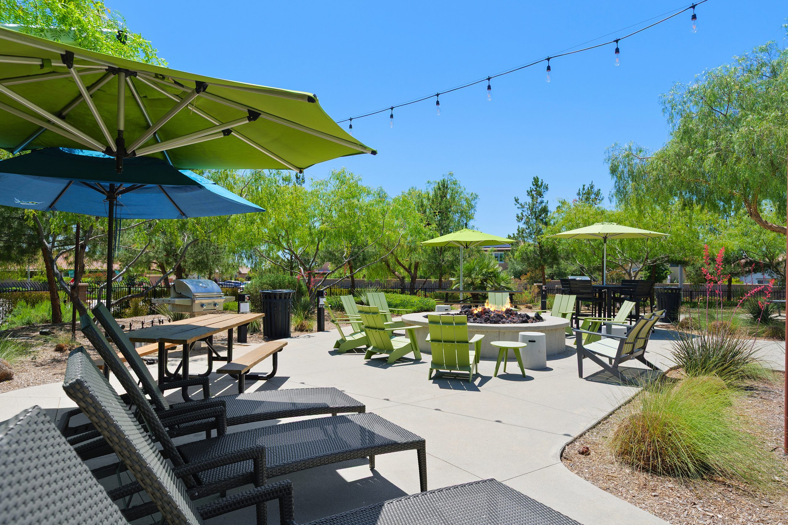 Lounge chairs and fire pit at The Oasis